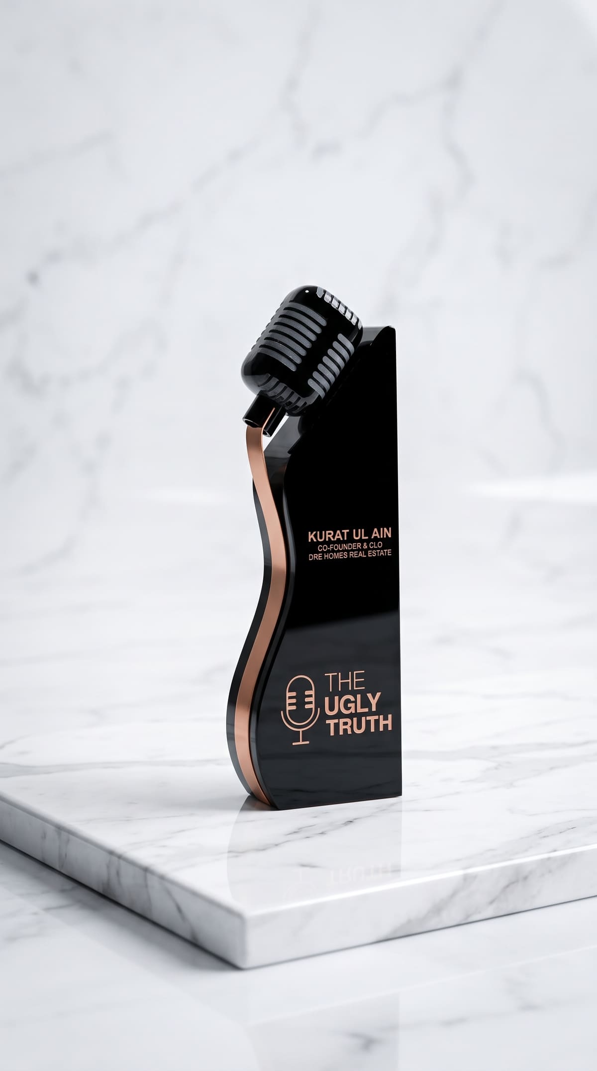 Black acrylic award with a microphone and a copper ribbon inlay, printed in copper lettering